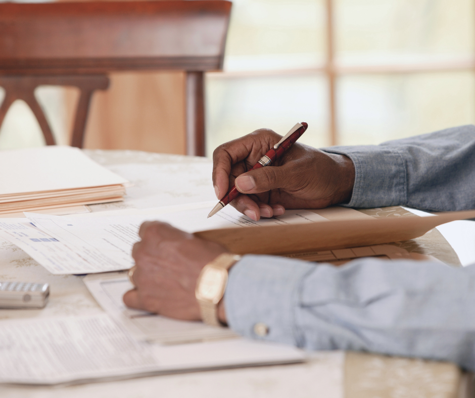 Simplify paperwork photo phto of a person doing paperwork